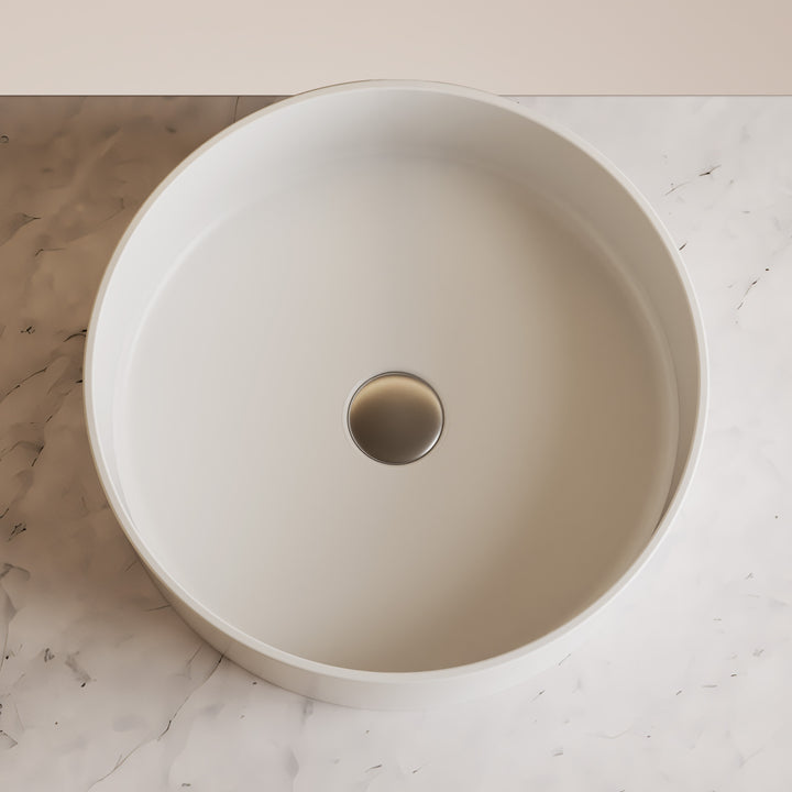 Beige ceramic sink on a marble countertop